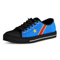 Low-top sneakers three-quarter view: blue flag graphic, yellow star, red stripe, black toe cap