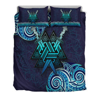 Navy-blue duvet cover with teal Valknut symbol and braided border on two pillows