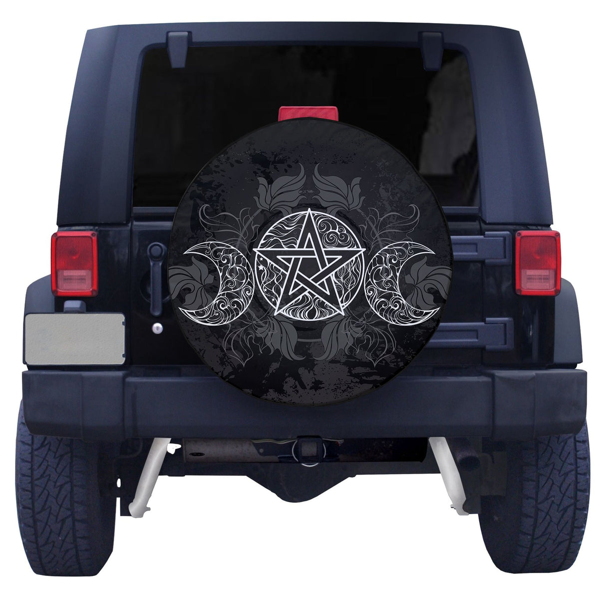 Black spare tire cover with white pentagram and curls, mounted on vehicle tailgate
