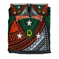 Green bedding set with two pillow covers, tribal shapes and custom text graphic in center