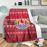 Red Tahiti-themed Christmas blanket with drum center, palm silhouettes, green tree rows, and stars