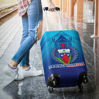 Blue luggage cover with Manu Samoa crest, rear view over wheeled suitcase