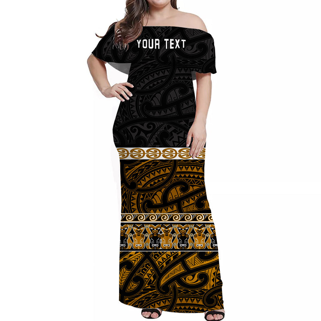 Off-shoulder long dress, black with gold Maori-style print, short sleeves