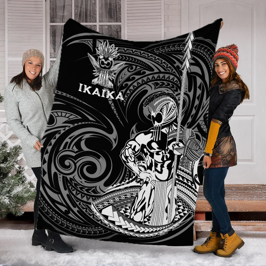 Large black and white Ikaika warrior tribal blanket spread wide, showing full character graphic