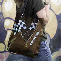 Leather tote hand bag with two handles, checkered racing flag print, and side zipper detail.