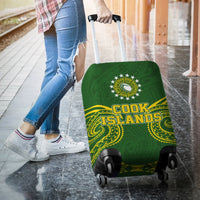 Green suitcase cover with tribal crest and Cook Islands lettering, rear view