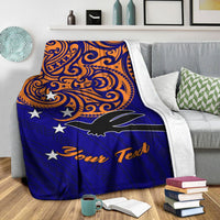Blue throw blanket over gray sofa, orange patterns, white stars, black bird, “Your Text”