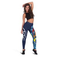 Blue leggings with colorful geometric panel and character artwork, full length