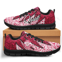 Low-top lace-up sneakers with red and white pattern, black sole and black laces