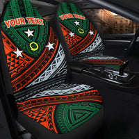 Front seat covers with green, orange, and white tribal print and star accents