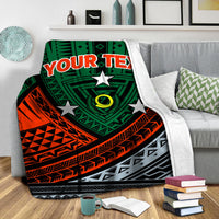Personalised tribal blanket showing green eye emblem, white stars, orange bands, and “YOUR TEXT”