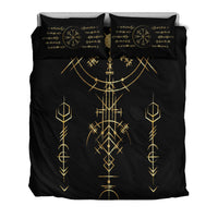 Black duvet set with gold geometric rune pattern and two pillowcases, compass at center