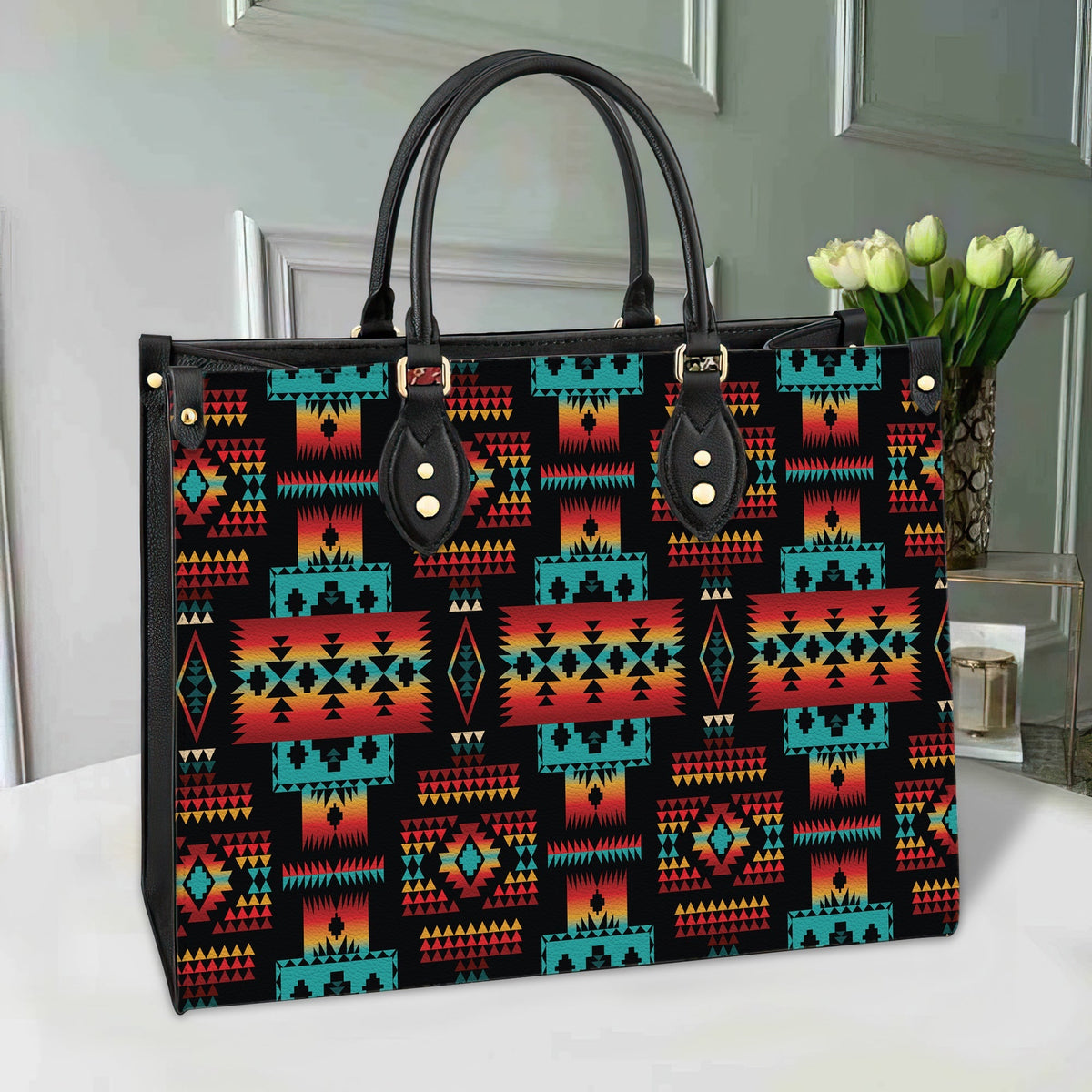 Multicolor geometric Native pattern leather tote with black handles and snap-front pocket