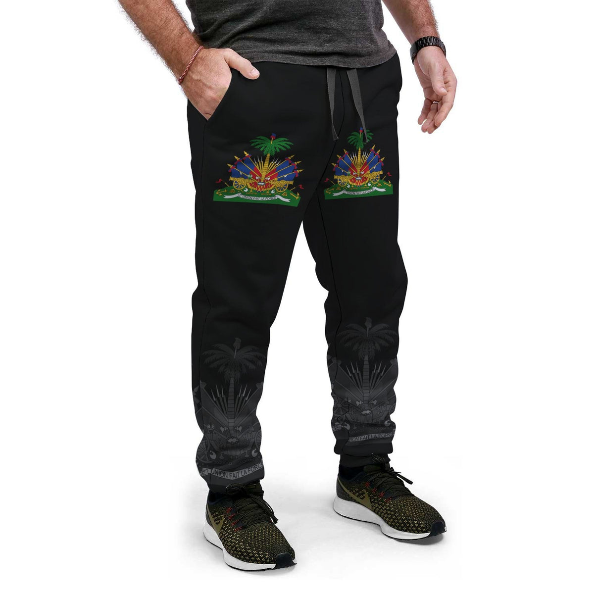 Black jogger pants with colorful Haitian crest front and palm print at lower legs