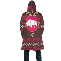 Brown hooded cloak with large bison emblem and repeating geometric patterns