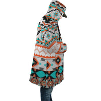 Hooded cloak in multicolor geometric pattern, side view with draped open front