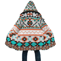 Front view hooded cloak with multicolor geometric print, wide drape and open hem