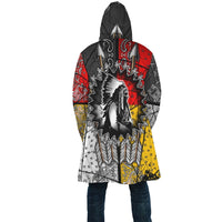 Back of hooded cloak, black red and yellow tribal graphic with central feather design