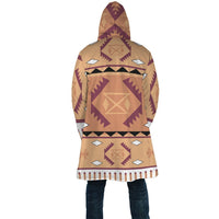 Back view hooded cloak with large central diamond tribal pattern, tan and purple
