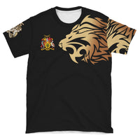 Black T-shirt flat lay with gold lion head graphic and small colorful crest