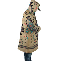 Side view unisex hooded cloak in tan with colorful Southwest geometric pattern
