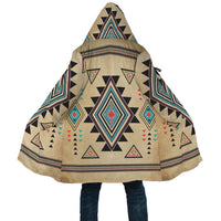 Hooded cloak with open sides, tan background and colorful Southwest geometric border print