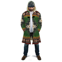 Unisex hooded cloak with Southwest green native-style symbol print, front view