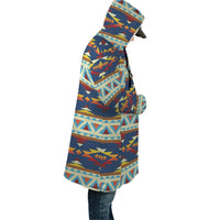 Multicolor tribal-print hooded cloak, side view with draped sleeves and pocket