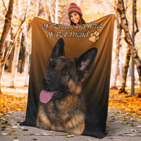 Orange pet blanket with German shepherd photo and text, paw print design