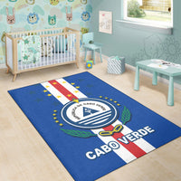 Blue Cabo Verde rug on the floor, flag stripes with circular seal and stars