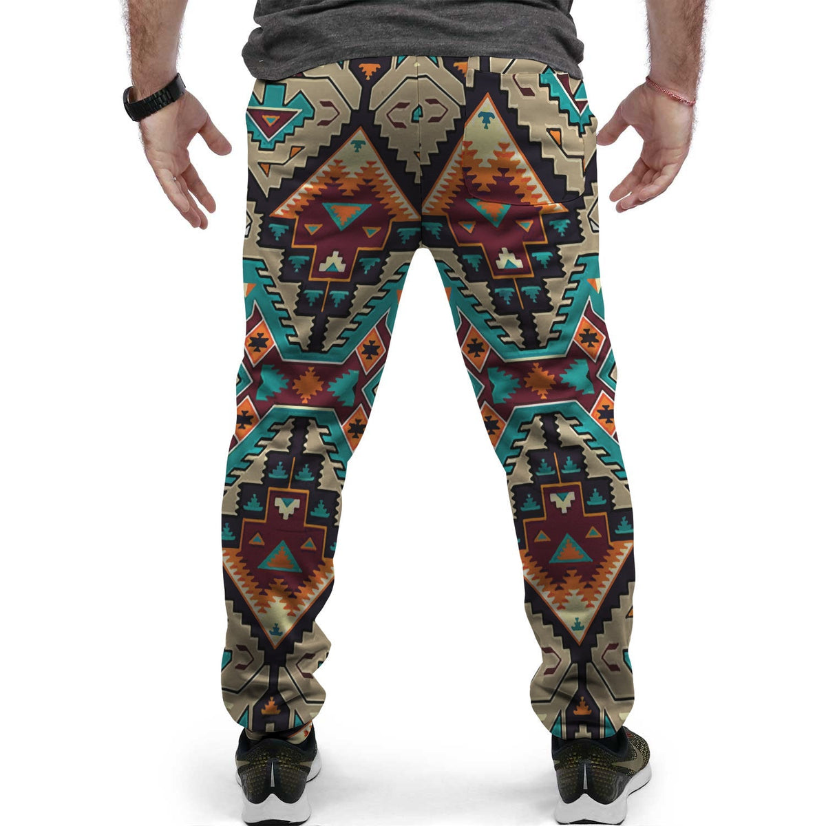 Jogger pants close-up on legs, multicolor southwestern pattern with tapered ankle cuffs