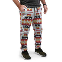 Light gray jogger pants with multicolor geometric Native-style pattern, tapered legs.