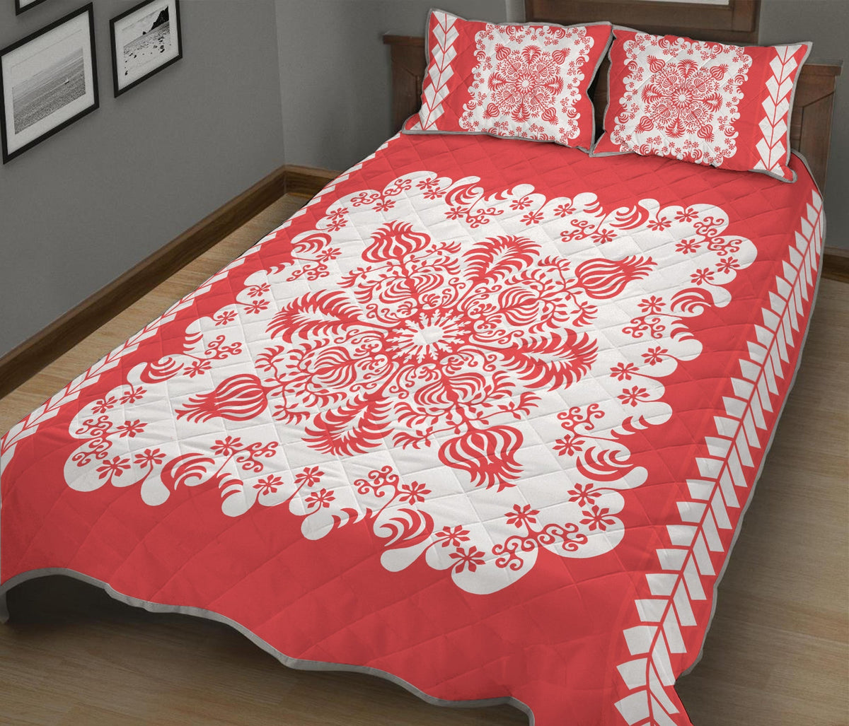 Red quilt bed set with white floral swirl medallions and geometric border; includes two shams