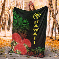 Black Hawaii Polynesian blanket with green patterns, red ohia blossoms, and yellow “HAWAII” lettering