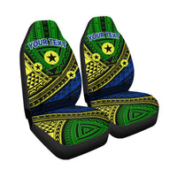 Isolated set of green/blue tribal seat covers with “YOUR TEXT” and star motifs