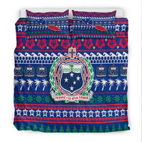 Blue bedding set with Samoa emblem shield, flower pattern band, and green Christmas tree row