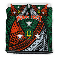 Green patterned duvet with star motifs and 'YOUR TEXT' across center