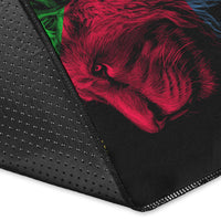 Black rug corner close-up with stitched edge and partial lion print