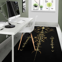 Black office rug with gold Viking compass runes and a central sun-like emblem