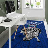Blue Samoan warrior pride rug in an office corner, with central warrior graphic and emblem