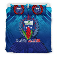 Blue Manu Samoa crest bedding set with two front pillows showing red laurel wreath design