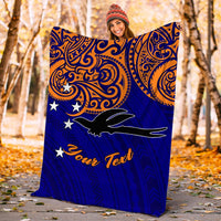 Blue personalized blanket with orange swirls, white stars, black bird and “Your Text”
