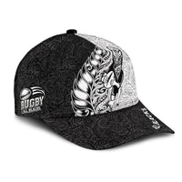 Black rugby cap with white-and-black Maori feather design and 'Rugby All Blacks' patch