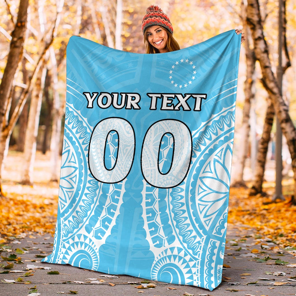 Blue outdoor personalized blanket draped, 'YOUR TEXT' with large '00' and tribal pattern