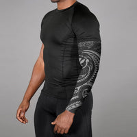 Black arm sleeve with Polynesian tribal wave graphic, partial upper-arm coverage