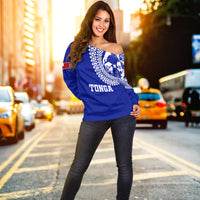 Women off-shoulder sweater in blue with white TONGA print and geometric shoulder trim