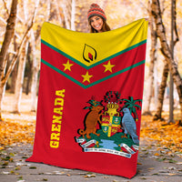 Grenada blanket held outdoors showing red base, yellow top, green stripes, coat of arms