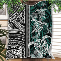 Draped Polynesian throw blanket featuring turtle and floral motifs, black, white, and green bands