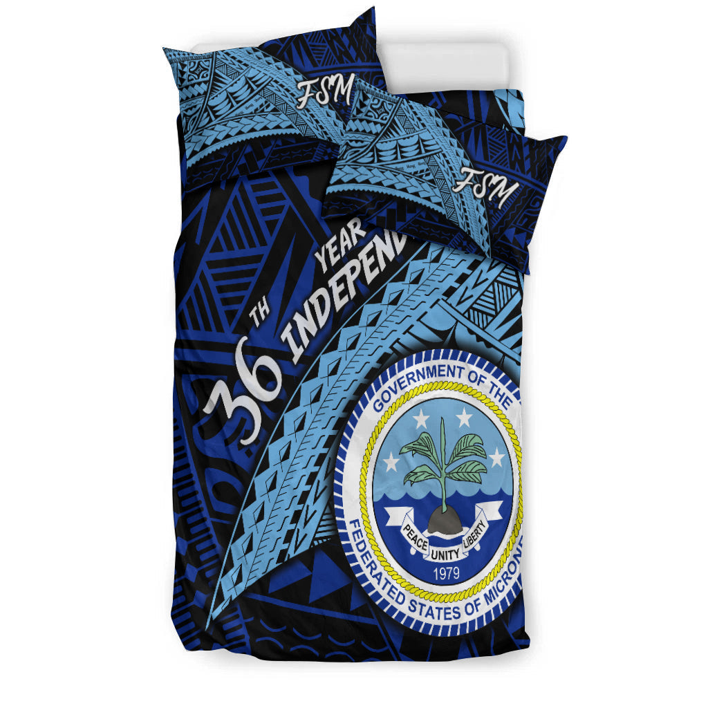 Blue bedding set with FSM logo, Independence Day text, and circular seal on duvet