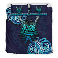 Navy-blue Viking bedding set with teal Valknut symbol on duvet and two pillows